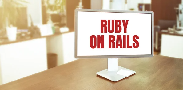 A desktop with a Ruby on Rails sign.