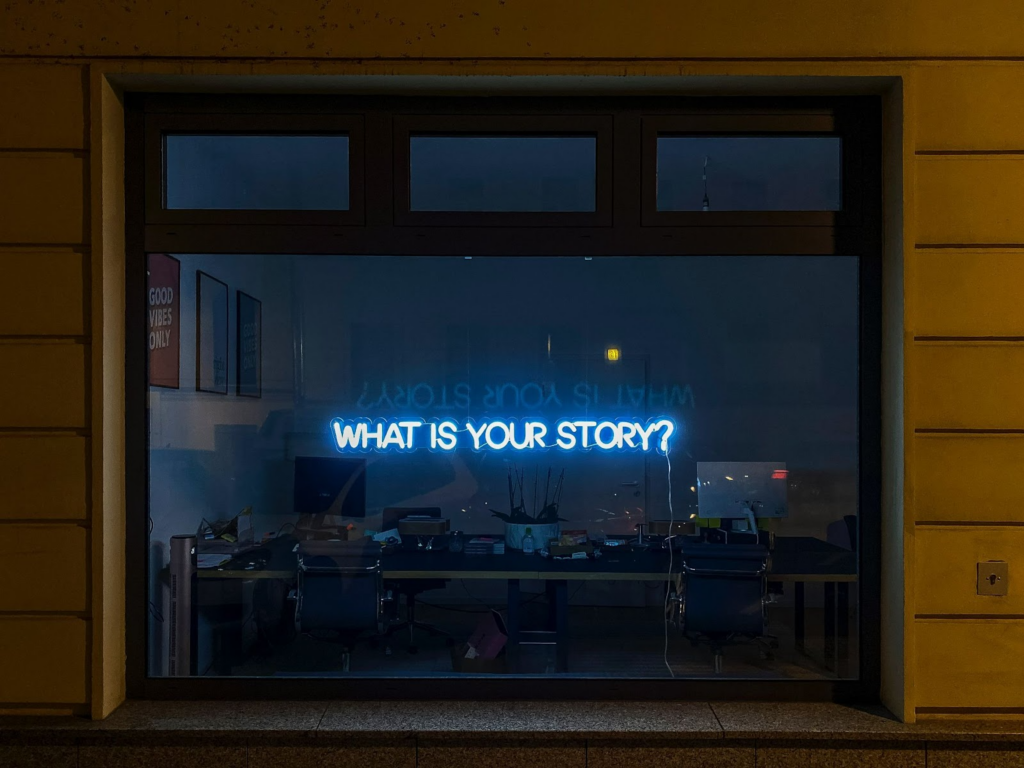 A window with a sign: What is your story? 